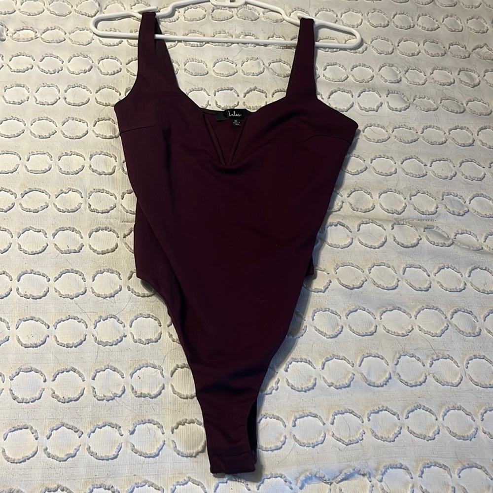 Lulu’s maroon snap-bottom body suit